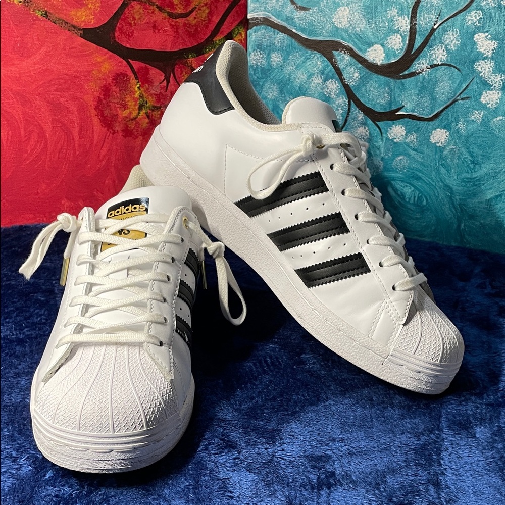 Adidas Superstar sneakers, specifically, Stan smith.